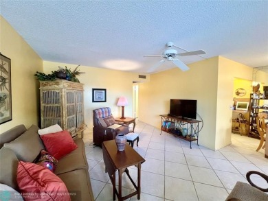WATERVIEW! FIRST FLOOR, TWO BEDROOM, TWO FULL BATH HOME WITH A on Hillsboro Pines Golf in Florida - for sale on GolfHomes.com, golf home, golf lot