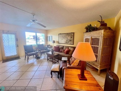 WATERVIEW! FIRST FLOOR, TWO BEDROOM, TWO FULL BATH HOME WITH A on Hillsboro Pines Golf in Florida - for sale on GolfHomes.com, golf home, golf lot