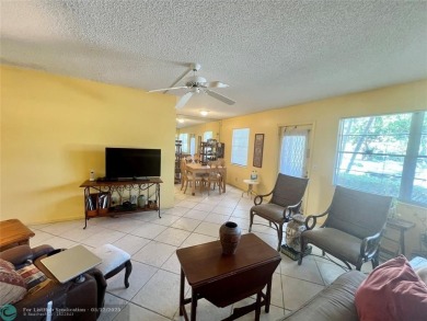 WATERVIEW! FIRST FLOOR, TWO BEDROOM, TWO FULL BATH HOME WITH A on Hillsboro Pines Golf in Florida - for sale on GolfHomes.com, golf home, golf lot