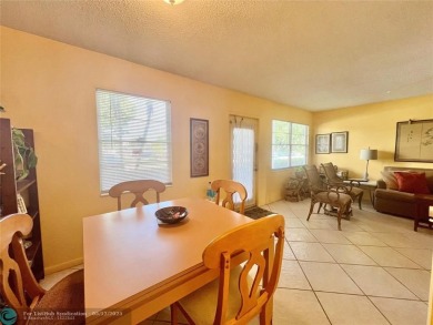 WATERVIEW! FIRST FLOOR, TWO BEDROOM, TWO FULL BATH HOME WITH A on Hillsboro Pines Golf in Florida - for sale on GolfHomes.com, golf home, golf lot