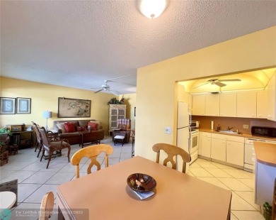 WATERVIEW! FIRST FLOOR, TWO BEDROOM, TWO FULL BATH HOME WITH A on Hillsboro Pines Golf in Florida - for sale on GolfHomes.com, golf home, golf lot