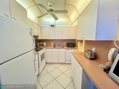 WATERVIEW! FIRST FLOOR, TWO BEDROOM, TWO FULL BATH HOME WITH A on Hillsboro Pines Golf in Florida - for sale on GolfHomes.com, golf home, golf lot