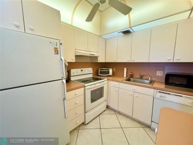 WATERVIEW! FIRST FLOOR, TWO BEDROOM, TWO FULL BATH HOME WITH A on Hillsboro Pines Golf in Florida - for sale on GolfHomes.com, golf home, golf lot