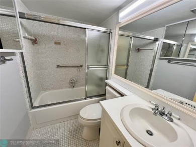 WATERVIEW! FIRST FLOOR, TWO BEDROOM, TWO FULL BATH HOME WITH A on Hillsboro Pines Golf in Florida - for sale on GolfHomes.com, golf home, golf lot