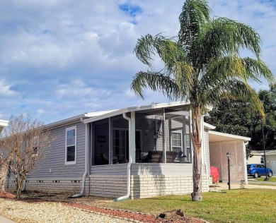 This high end Manufactured home on an Ultimately landscaped on Water Oak Country Club Estates in Florida - for sale on GolfHomes.com, golf home, golf lot