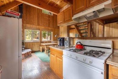 Enveloped by a quiet grove of mature pines and backing to a on Big Bear Mountain Ski and Golf Resort in California - for sale on GolfHomes.com, golf home, golf lot