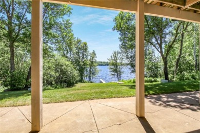 Discover this exquisite waterfront property situated on the on Barker Lake Country Club in Wisconsin - for sale on GolfHomes.com, golf home, golf lot