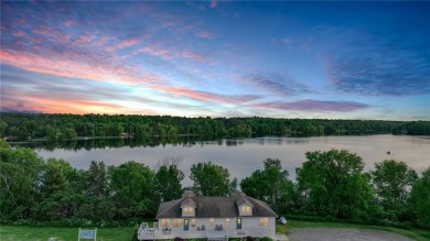 Discover this exquisite waterfront property situated on the on Barker Lake Country Club in Wisconsin - for sale on GolfHomes.com, golf home, golf lot