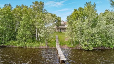 Discover this exquisite waterfront property situated on the on Barker Lake Country Club in Wisconsin - for sale on GolfHomes.com, golf home, golf lot