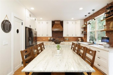 This custom-built home sits on a roundabout cul-de-sac nestled on Hampton Golf Village in Georgia - for sale on GolfHomes.com, golf home, golf lot