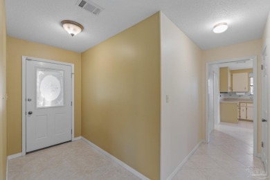 Charming Gulf Breeze brick home nestled in a picturesque setting on Tiger Point Golf and Country Club in Florida - for sale on GolfHomes.com, golf home, golf lot