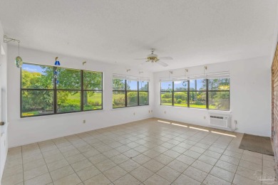 Charming Gulf Breeze brick home nestled in a picturesque setting on Tiger Point Golf and Country Club in Florida - for sale on GolfHomes.com, golf home, golf lot