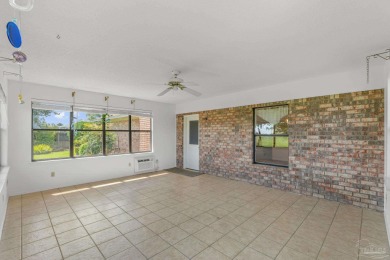 Charming Gulf Breeze brick home nestled in a picturesque setting on Tiger Point Golf and Country Club in Florida - for sale on GolfHomes.com, golf home, golf lot