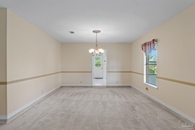 Charming Gulf Breeze brick home nestled in a picturesque setting on Tiger Point Golf and Country Club in Florida - for sale on GolfHomes.com, golf home, golf lot