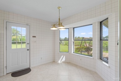 Charming Gulf Breeze brick home nestled in a picturesque setting on Tiger Point Golf and Country Club in Florida - for sale on GolfHomes.com, golf home, golf lot