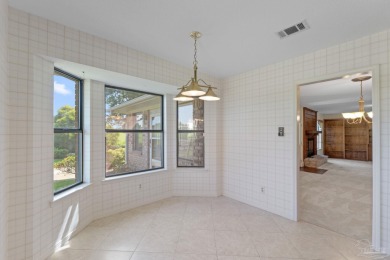 Charming Gulf Breeze brick home nestled in a picturesque setting on Tiger Point Golf and Country Club in Florida - for sale on GolfHomes.com, golf home, golf lot