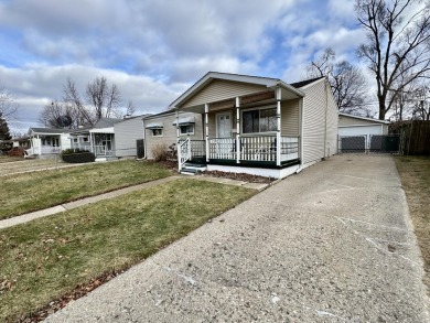 Welcome to this charming 3 bedroom, 1 bath ranch nestled in the on Green Oaks Golf Course in Michigan - for sale on GolfHomes.com, golf home, golf lot