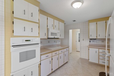 Charming Gulf Breeze brick home nestled in a picturesque setting on Tiger Point Golf and Country Club in Florida - for sale on GolfHomes.com, golf home, golf lot