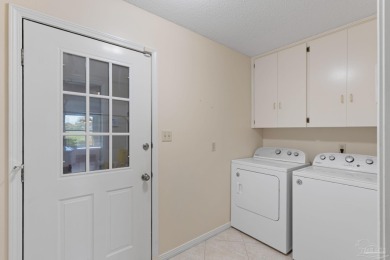 Charming Gulf Breeze brick home nestled in a picturesque setting on Tiger Point Golf and Country Club in Florida - for sale on GolfHomes.com, golf home, golf lot