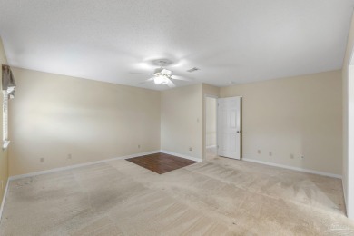 Charming Gulf Breeze brick home nestled in a picturesque setting on Tiger Point Golf and Country Club in Florida - for sale on GolfHomes.com, golf home, golf lot