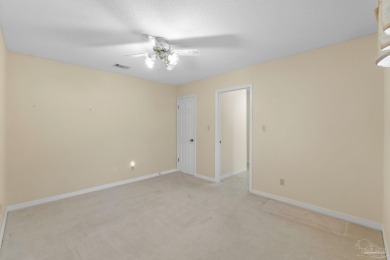 Charming Gulf Breeze brick home nestled in a picturesque setting on Tiger Point Golf and Country Club in Florida - for sale on GolfHomes.com, golf home, golf lot