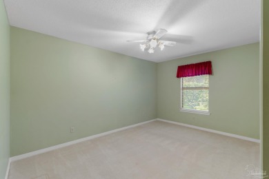Charming Gulf Breeze brick home nestled in a picturesque setting on Tiger Point Golf and Country Club in Florida - for sale on GolfHomes.com, golf home, golf lot