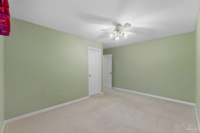 Charming Gulf Breeze brick home nestled in a picturesque setting on Tiger Point Golf and Country Club in Florida - for sale on GolfHomes.com, golf home, golf lot