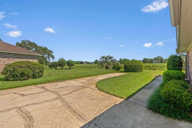 Charming Gulf Breeze brick home nestled in a picturesque setting on Tiger Point Golf and Country Club in Florida - for sale on GolfHomes.com, golf home, golf lot
