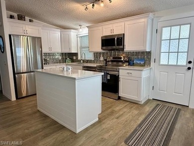 Welcome to one of Naples' best-kept secrets! Ideally located on Glen Eagle Golf and Country Club in Florida - for sale on GolfHomes.com, golf home, golf lot