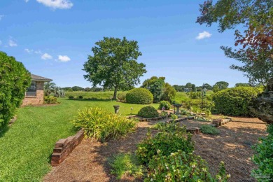 Charming Gulf Breeze brick home nestled in a picturesque setting on Tiger Point Golf and Country Club in Florida - for sale on GolfHomes.com, golf home, golf lot
