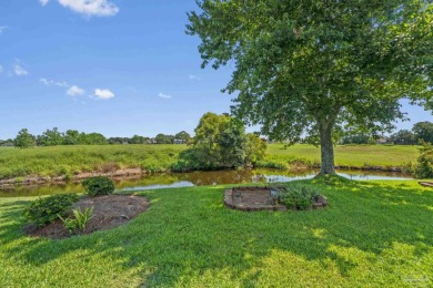 Charming Gulf Breeze brick home nestled in a picturesque setting on Tiger Point Golf and Country Club in Florida - for sale on GolfHomes.com, golf home, golf lot