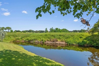 Charming Gulf Breeze brick home nestled in a picturesque setting on Tiger Point Golf and Country Club in Florida - for sale on GolfHomes.com, golf home, golf lot