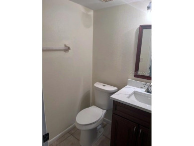A solid two-story 4 bed/ 2.5 bath, 2 car garage, pool home is on Northdale Golf and Tennis Club in Florida - for sale on GolfHomes.com, golf home, golf lot