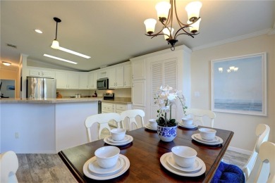 Enjoy direct golf course and water views from this beautifully on Barefoot Bay Golf Course in Florida - for sale on GolfHomes.com, golf home, golf lot