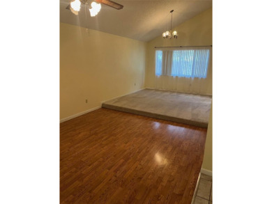 A solid two-story 4 bed/ 2.5 bath, 2 car garage, pool home is on Northdale Golf and Tennis Club in Florida - for sale on GolfHomes.com, golf home, golf lot