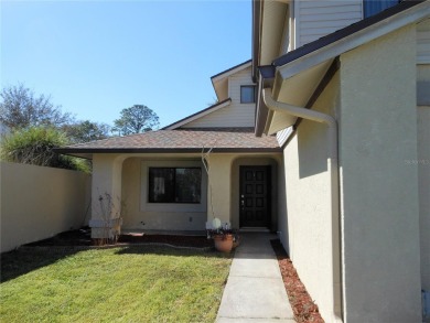 A solid two-story 4 bed/ 2.5 bath, 2 car garage, pool home is on Northdale Golf and Tennis Club in Florida - for sale on GolfHomes.com, golf home, golf lot