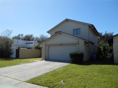 A solid two-story 4 bed/ 2.5 bath, 2 car garage, pool home is on Northdale Golf and Tennis Club in Florida - for sale on GolfHomes.com, golf home, golf lot