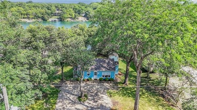 This quaint and charming LAKEFRONT bungalow offers a peaceful on Linn Valley Lakes - Deer Trace Golf Course in Kansas - for sale on GolfHomes.com, golf home, golf lot