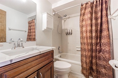 A solid 4 bed/ 2.5 bath, 2 car garage, pool home is located in on Northdale Golf and Tennis Club in Florida - for sale on GolfHomes.com, golf home, golf lot