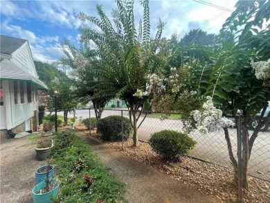 Check out this charming 3 bedroom, 1 bath bungalow in Decatur on East Lake Golf Club in Georgia - for sale on GolfHomes.com, golf home, golf lot