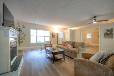 This quaint and charming LAKEFRONT bungalow offers a peaceful on Linn Valley Lakes - Deer Trace Golf Course in Kansas - for sale on GolfHomes.com, golf home, golf lot