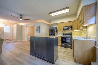 This quaint and charming LAKEFRONT bungalow offers a peaceful on Linn Valley Lakes - Deer Trace Golf Course in Kansas - for sale on GolfHomes.com, golf home, golf lot