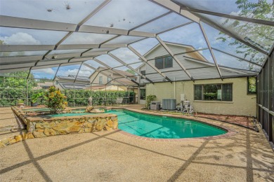 A solid 4 bed/ 2.5 bath, 2 car garage, pool home is located in on Northdale Golf and Tennis Club in Florida - for sale on GolfHomes.com, golf home, golf lot