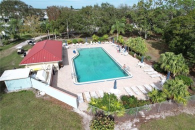 Enjoy direct golf course and water views from this beautifully on Barefoot Bay Golf Course in Florida - for sale on GolfHomes.com, golf home, golf lot