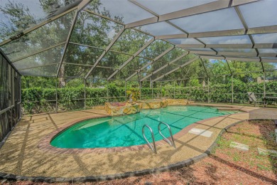 A solid 4 bed/ 2.5 bath, 2 car garage, pool home is located in on Northdale Golf and Tennis Club in Florida - for sale on GolfHomes.com, golf home, golf lot