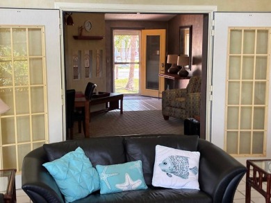 Unique home in Del Tura (55 and over community on leased land) on Del Tura Golf and Country Club in Florida - for sale on GolfHomes.com, golf home, golf lot