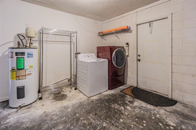 A solid 4 bed/ 2.5 bath, 2 car garage, pool home is located in on Northdale Golf and Tennis Club in Florida - for sale on GolfHomes.com, golf home, golf lot