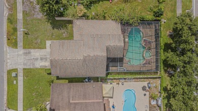 A solid 4 bed/ 2.5 bath, 2 car garage, pool home is located in on Northdale Golf and Tennis Club in Florida - for sale on GolfHomes.com, golf home, golf lot
