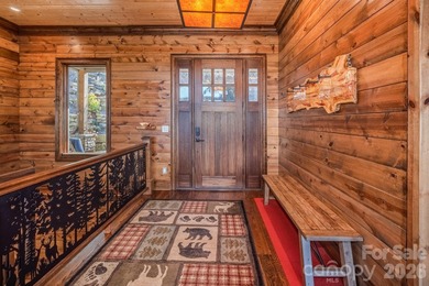 Set along the pristine shoreline of Ticoa Lake in the highly on Connestee Falls Golf Club in North Carolina - for sale on GolfHomes.com, golf home, golf lot