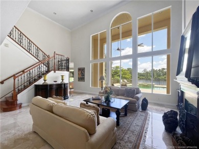 PRIVATE LAKESIDE RETREAT - This updated 5 BR, 6 bath, 4 garage on The Cape Club of Palm City in Florida - for sale on GolfHomes.com, golf home, golf lot
